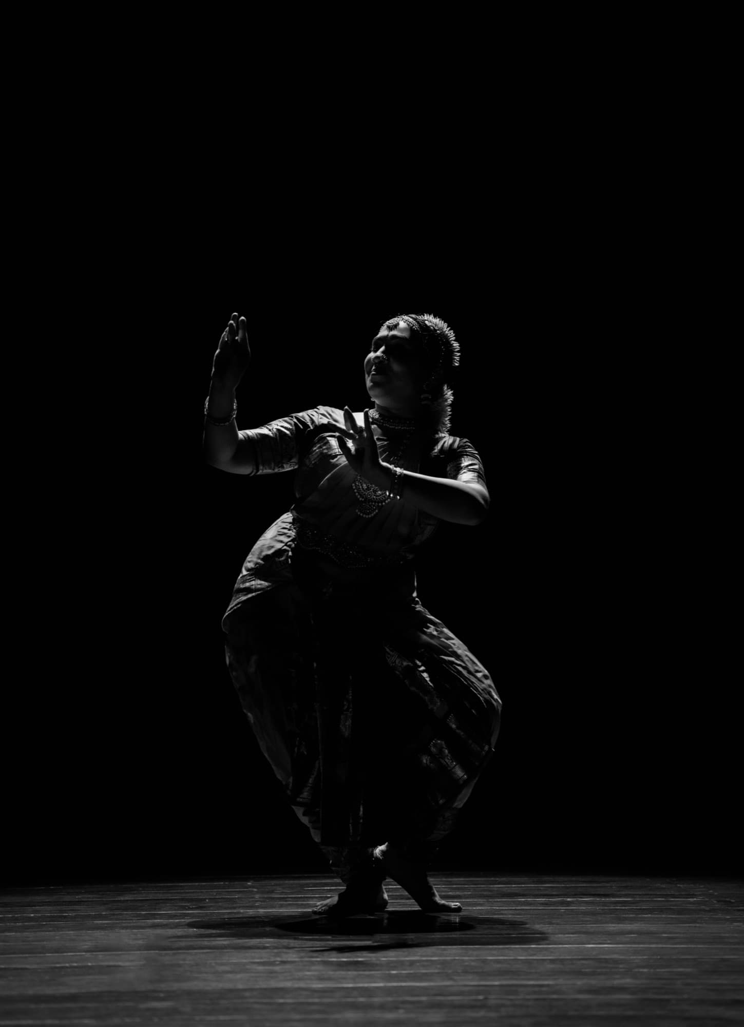 Bharatanatyam dancer performing on stage at Anura Academy